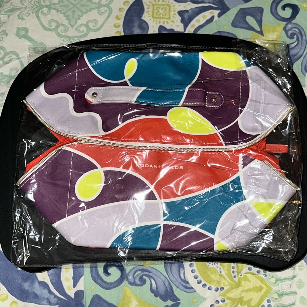 Rodan+Fields Multi-colored zippered makeup/toiletry/cosmetic bag/case
